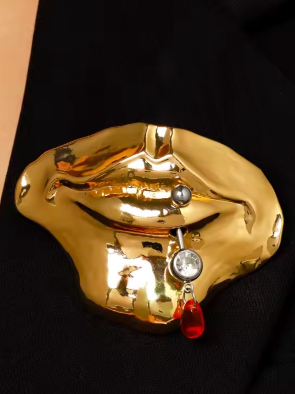 Gold Tone Lip-Shaped Brooch with Red Teardrop Charm